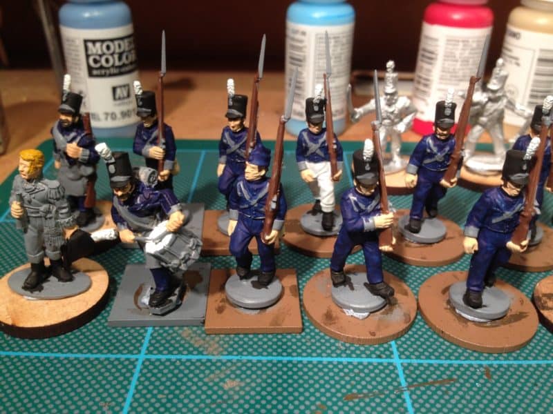The final 12 figures are on the painting desk.